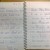 Image of spiral notebook with letter from teacher to student opposite a letter from student to teacher.